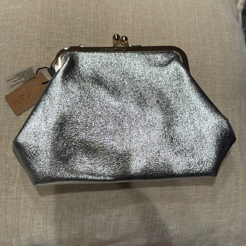 med/large silver clutch
brand new 
never used